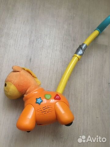 Игрушка каталка музыкальная Игрушка каталка музыкальная